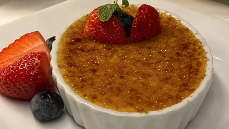 Ruth's Chris creme brulee dessert with fresh berries.