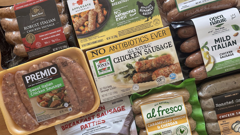 Variety of chicken sausages on wooden table