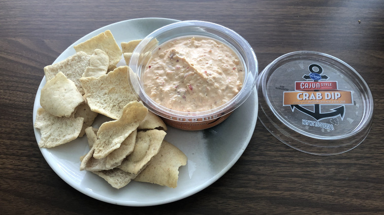 Kroger Cajun Style Crab Dip on plate with pita chips.