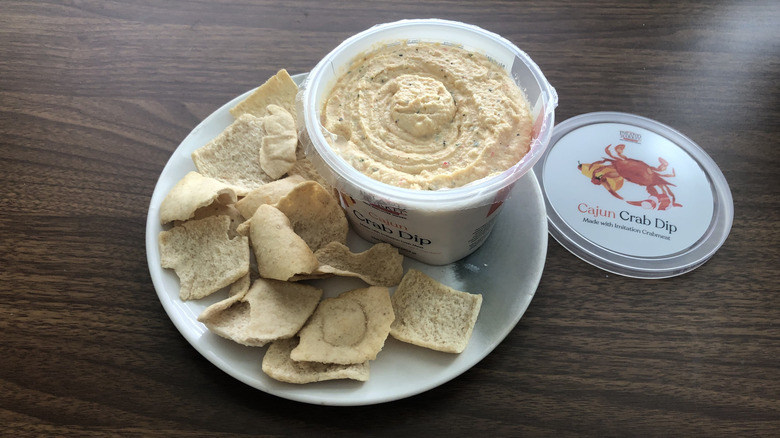 Inland Market Cajun crab dip on plate with pita chips.