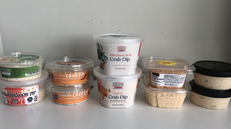 9 store-bought crab dips stacked on top of each other.