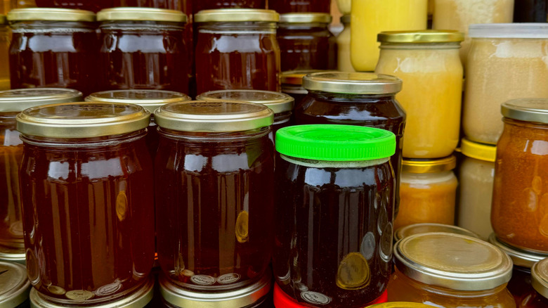 Honey store counter top full of types of honey jars