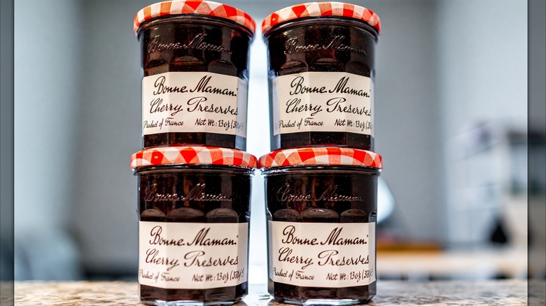 Four jars of Bonne Maman cherry preserves jam