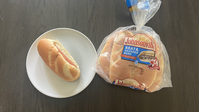Aunt Millie's Johnsonville Brats and Sausage Bun pack with prepped hot dog on plate