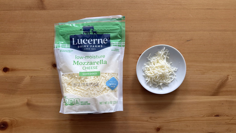 Lucerne Shredded Low-Moisture Mozzarella Cheese on wooden table