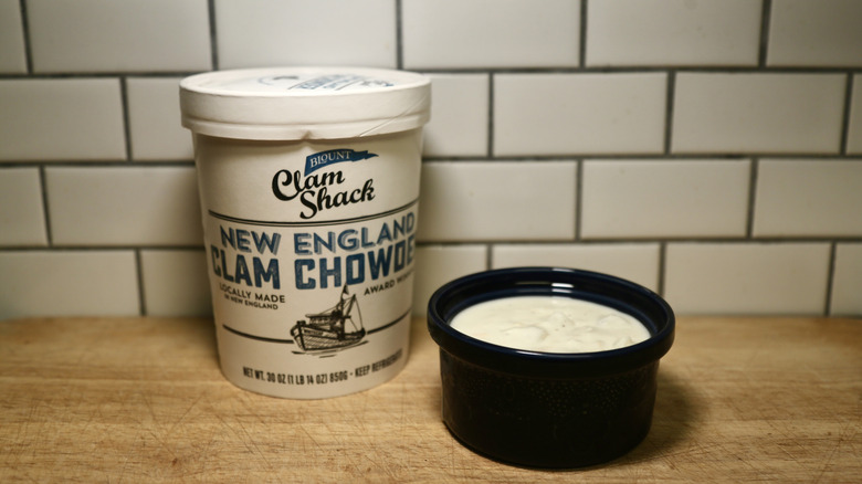 container of chowder with bowl