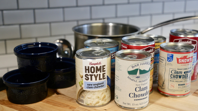 Soup cans with bowls and a pot
