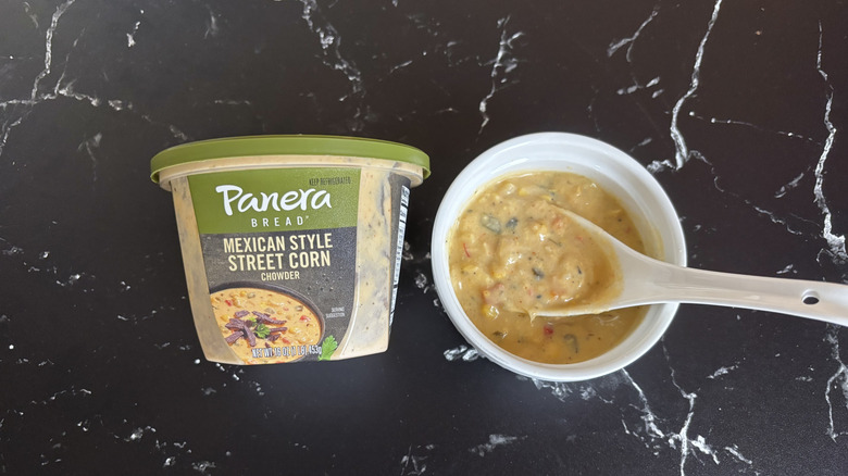 Panera Mexican style street corn chowder container next to bowl of chowder