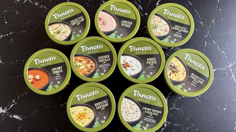 Various Panera Bread soup containers on countertop