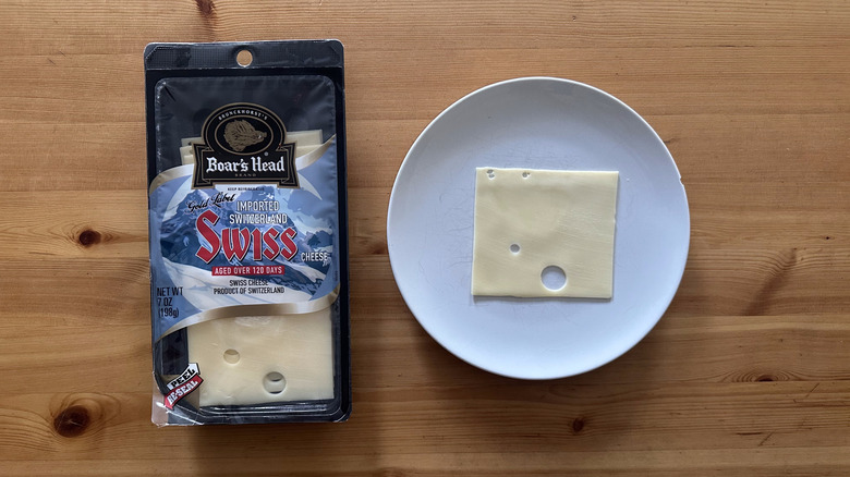 Boar's Head Gold Label Imported Switzerland Swiss Cheese on wooden table