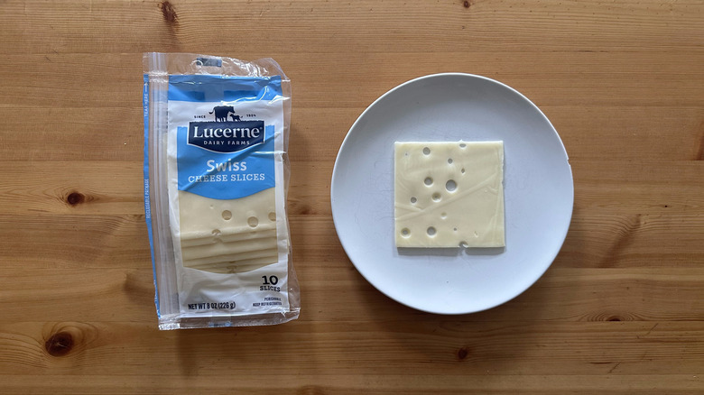 Lucerne Swiss Cheese Slices on wooden table