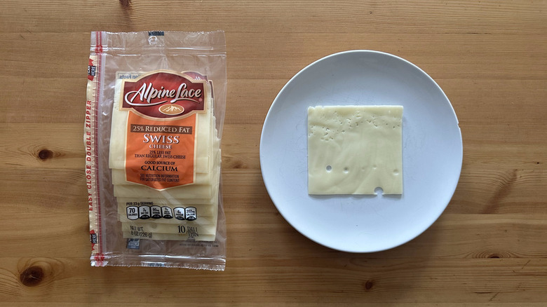 Alpine Lace Reduced Fat Swiss Cheese on wooden table