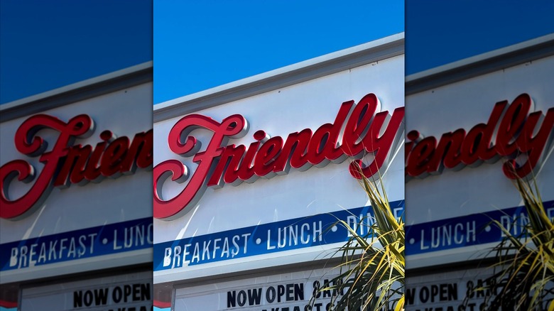 Friendly's sign on restaurant against blue sky