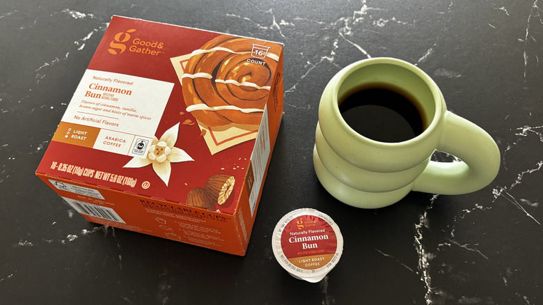 Good & Gather cinnamon bun coffee pod box, coffee pod, and cup of coffee