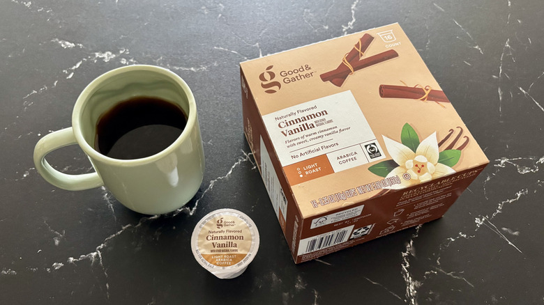 Cup of coffee, coffee pod, and Good & Gather cinnamon vanilla coffee pod box