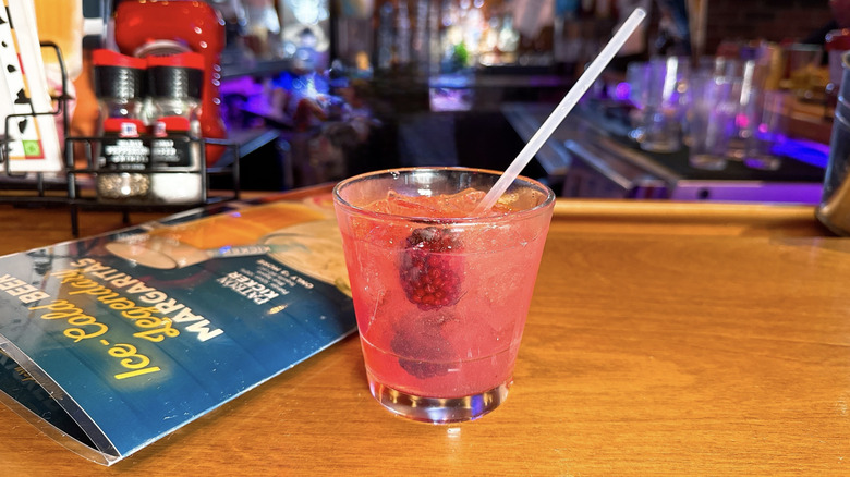 Texas Roadhouse Midnight Sour cocktail on a bar