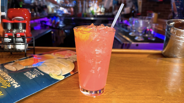 Texas Roadhouse Pink Sunset cocktail on a bar