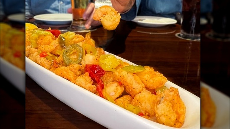 Fried shrimp appetizer in white boat-style dish at LongHorn.