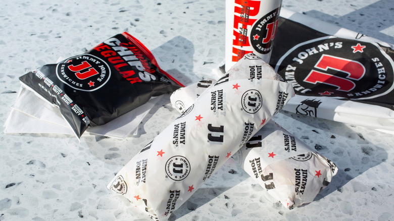 A view of a Jimmy John's combo meal with wrapped sandwiches on a counter