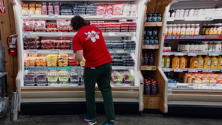 Trader Joe's crew member stocking shelves