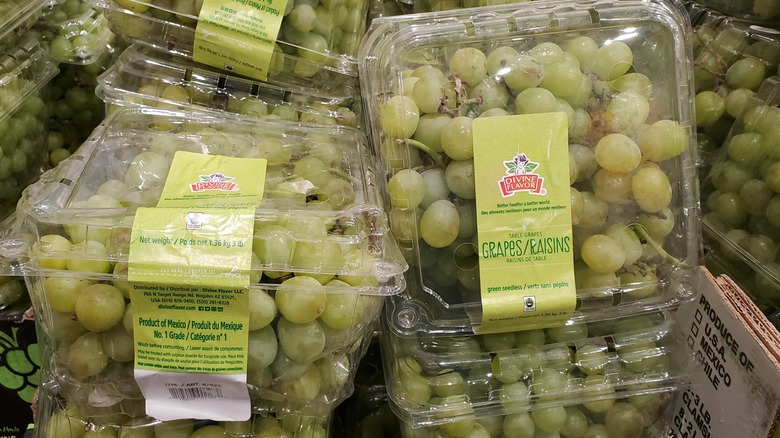 Various containers of green seedless grapes at Costco