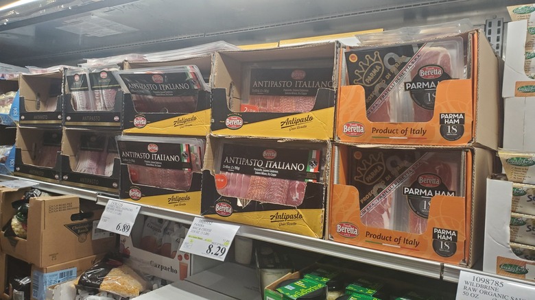 A refrigerator container at Costco with charcuterie meats