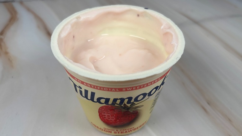 Angled down shot of open container of Tillamook Oregon Strawberry yogurt cup