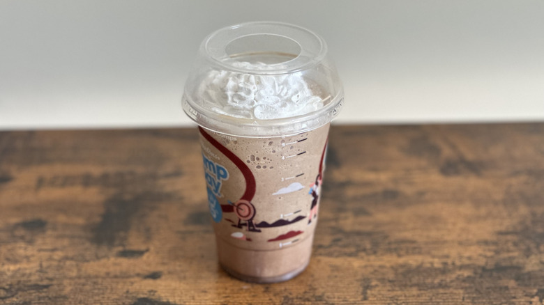 Plastic cup of Tim Hortons Mocha Iced Capp on wooden table
