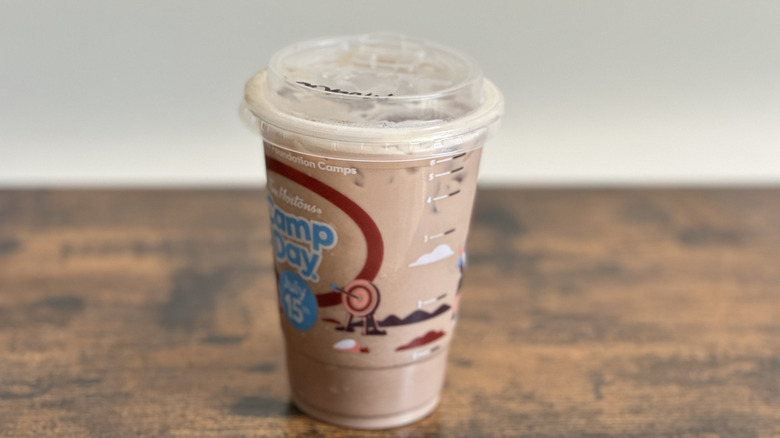 Plastic cup of Tim Hortons Iced Mocha Latte on wooden table