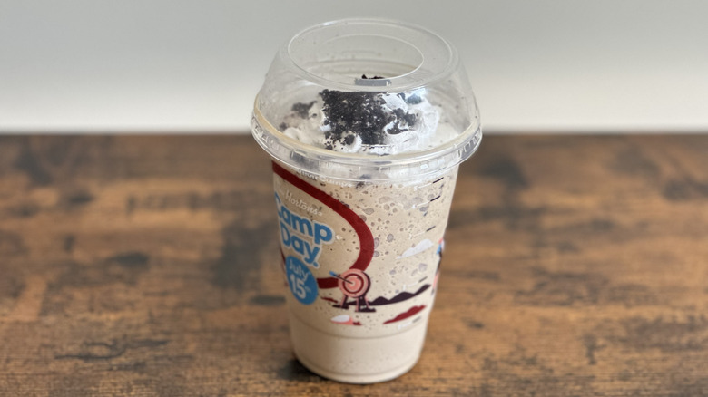 Plastic cup of Tim Hortons Oreo Iced Capp on wooden table