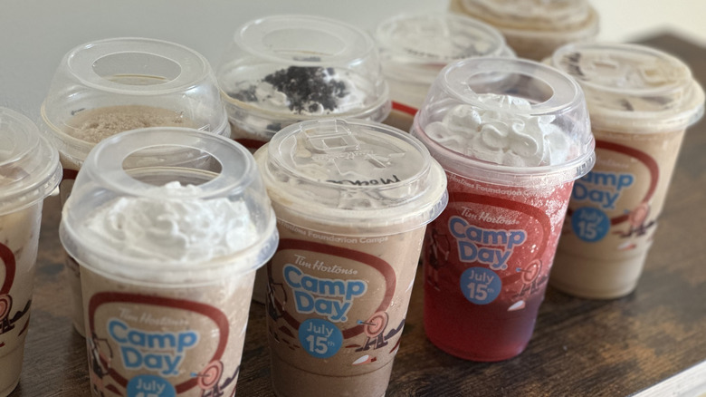 Diagonal shot of various cold Time Hortons drinks on wooden table