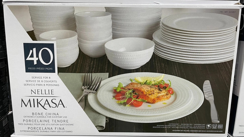 A box containing a 40 piece dinnerware set from the brand Mikasa.