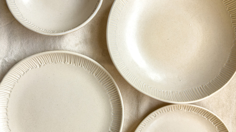 Overhead view of two gray stoneware plates on a table