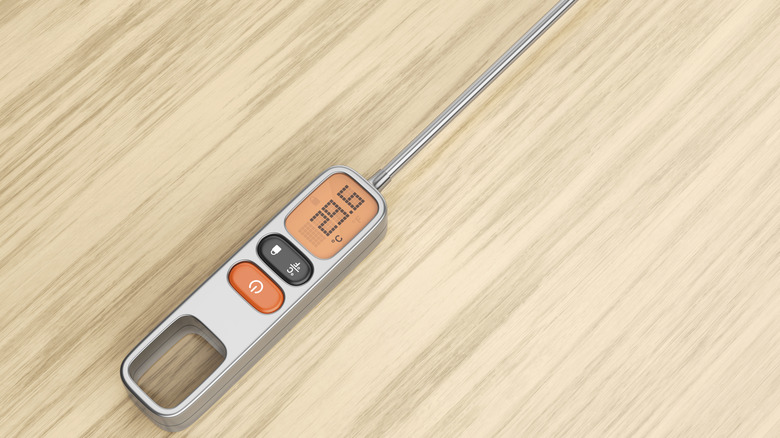 Meat thermometer on wooden table