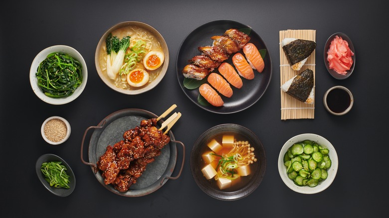 an array of Japanese dishes displayed on a table