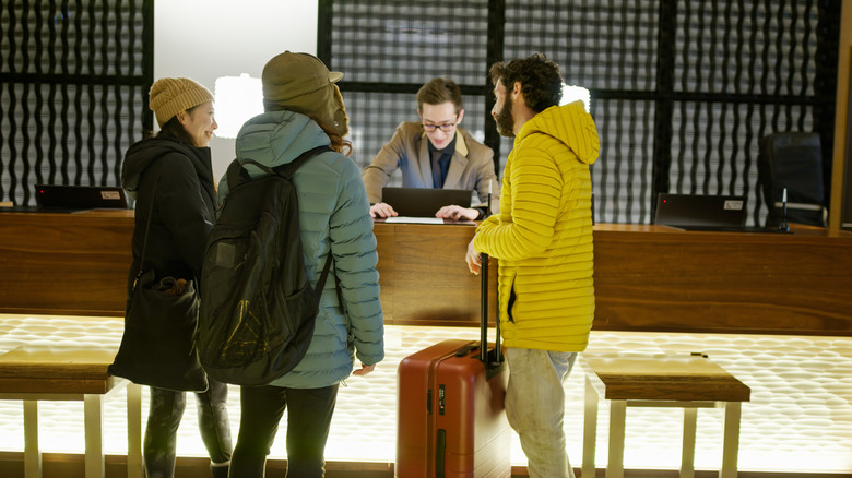 hotel guests in Japan speaking to hotel staff