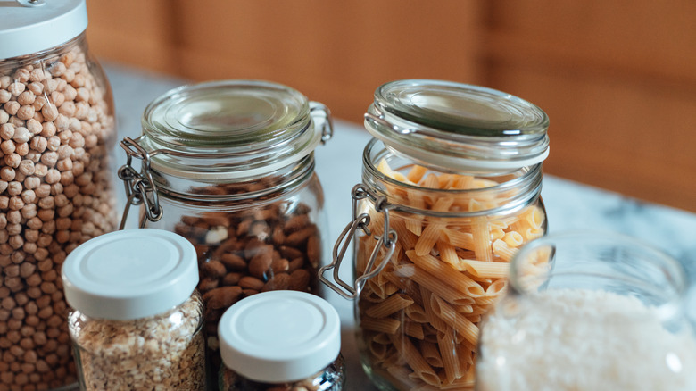 Dried goods stored in glass jars on counter