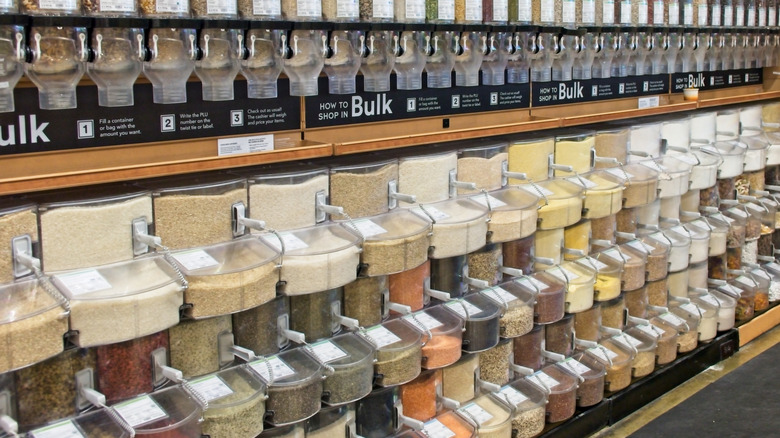 Bulk bin section with scoops at grocery store