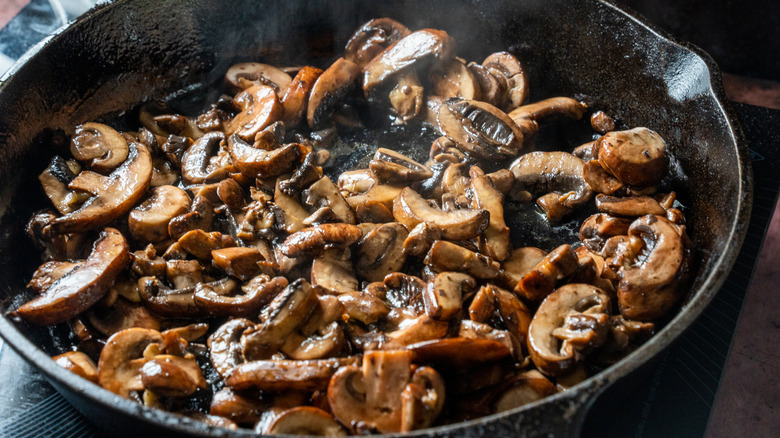 Mushrooms being sauteed in a pan