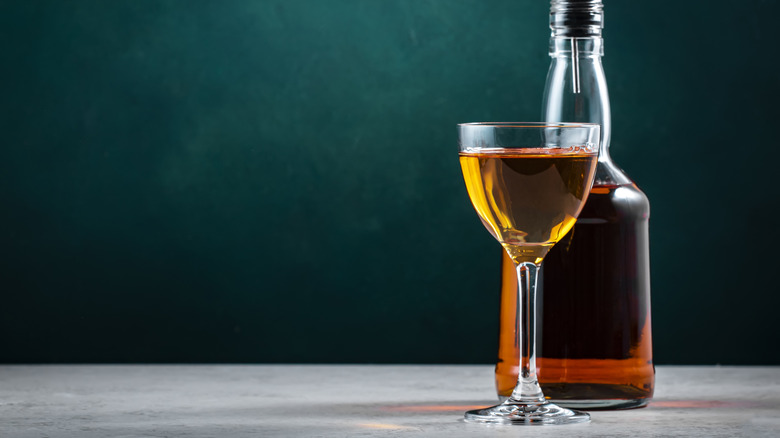Glass of sherry sitting in front of bottle