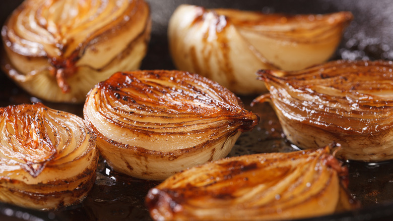 roasted onion halves in pan