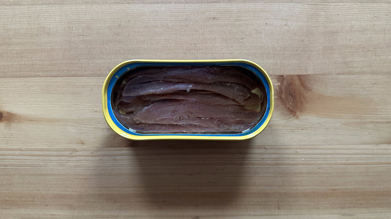 Can of Trader Joe's Anchovy Fillets in Olive Oil on wooden table