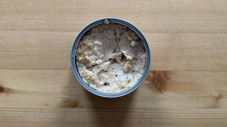 Can of Trader Joe's Solid White Albacore Tuna in Olive Oil on wooden table