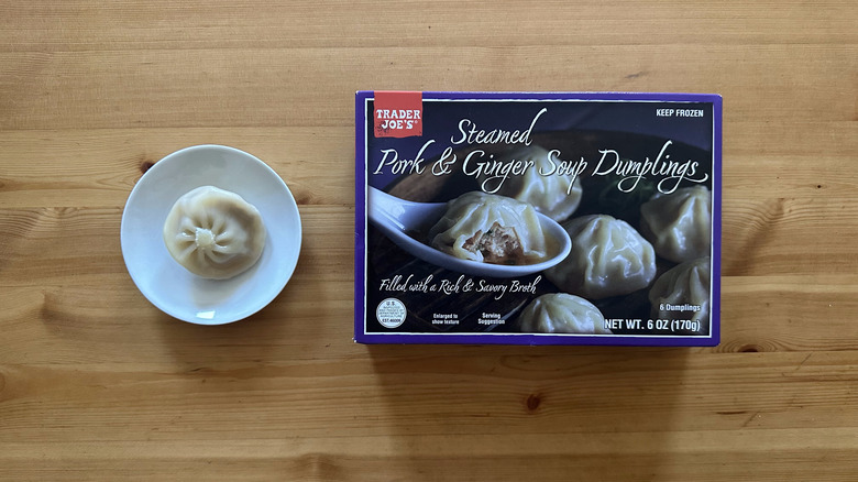 Trader Joe's Steamed Pork and Ginger Soup Dumplings on wooden table