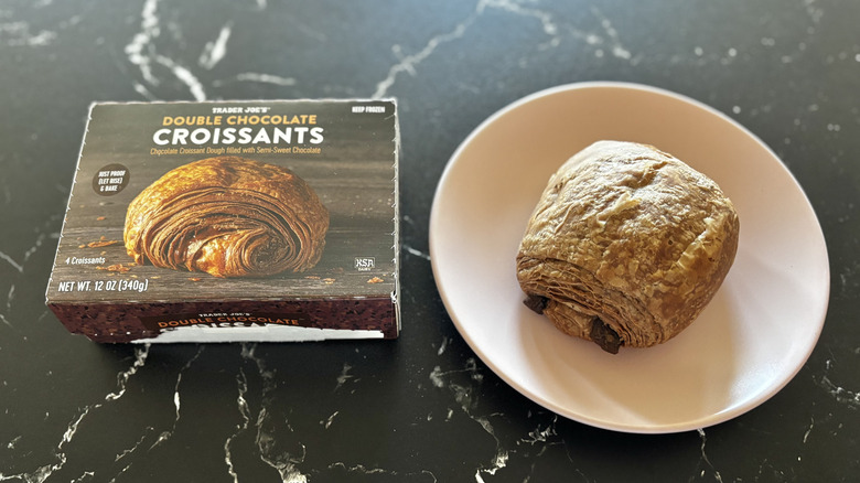 Trader Joe's double chocolate croissants box next to chocolate croissant on plate