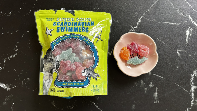 Trader Joe's sour Scandinavian Swimmers bag next to sour candies in small bowl