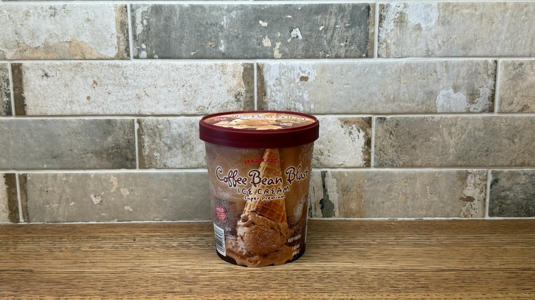 Trader Joe's Coffee Bean Blast ice cream on a wooden counter with a brick-like background