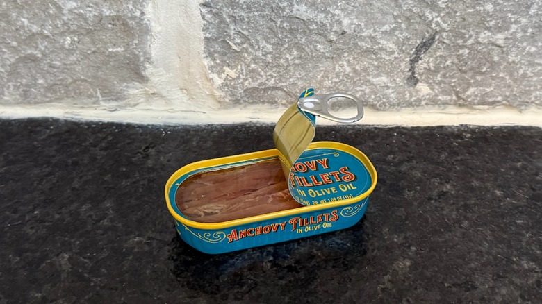 Half opened tin of anchovy fillets in olive oil from Trader Joe's