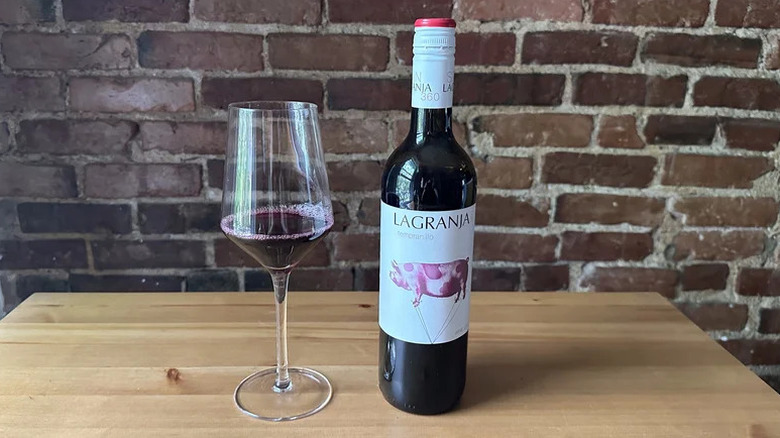Bottle of La Granja 360 Tempranillo on wooden table
