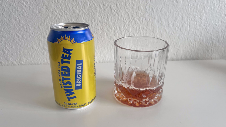 Original Twisted Tea can next to a glass